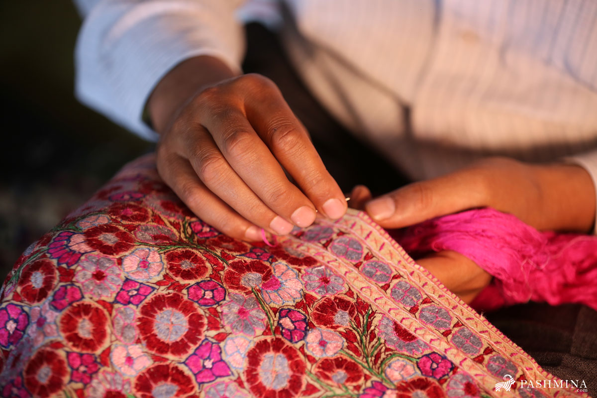 Pashmina Artisan doing Embroidery work on a Pashmina Shawl