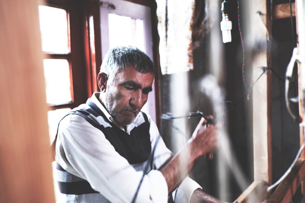 Artisan weaving on Hand Loom